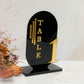 Black laser cut acrylic curved table number layered with gold mirror lettering and numbers 